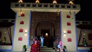 A traditional building with ornate architecture, a central doorway, and decorative lighting. - Chokar Dhani Raipur (Raipur)