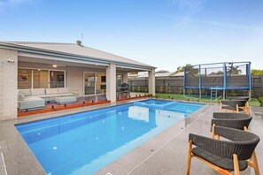 Outdoor pool, a heated pool - Meadow by the Sea by Ready Set Stay - Trampoline, Pool, Spa, Table Tennis, Linen (Rye)