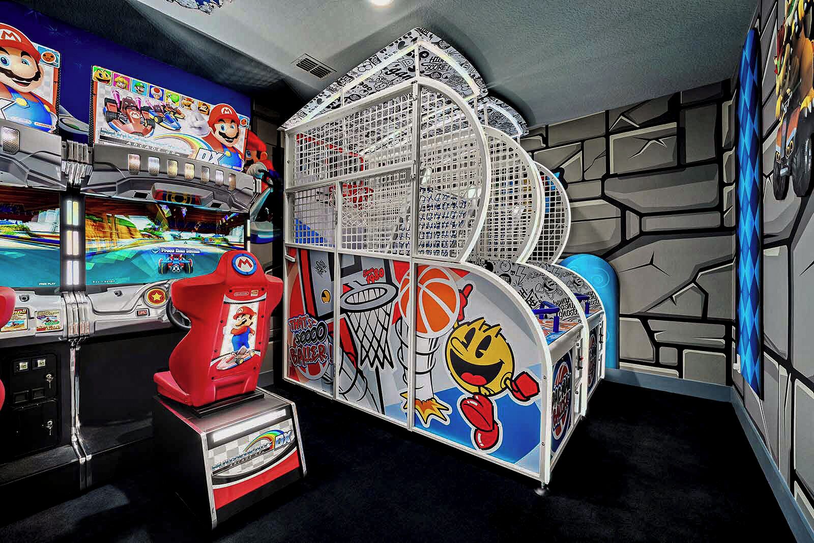 A gaming arcade with multiple Nintendo 64 consoles, a red Mario-themed machine, and a basketball-themed game.