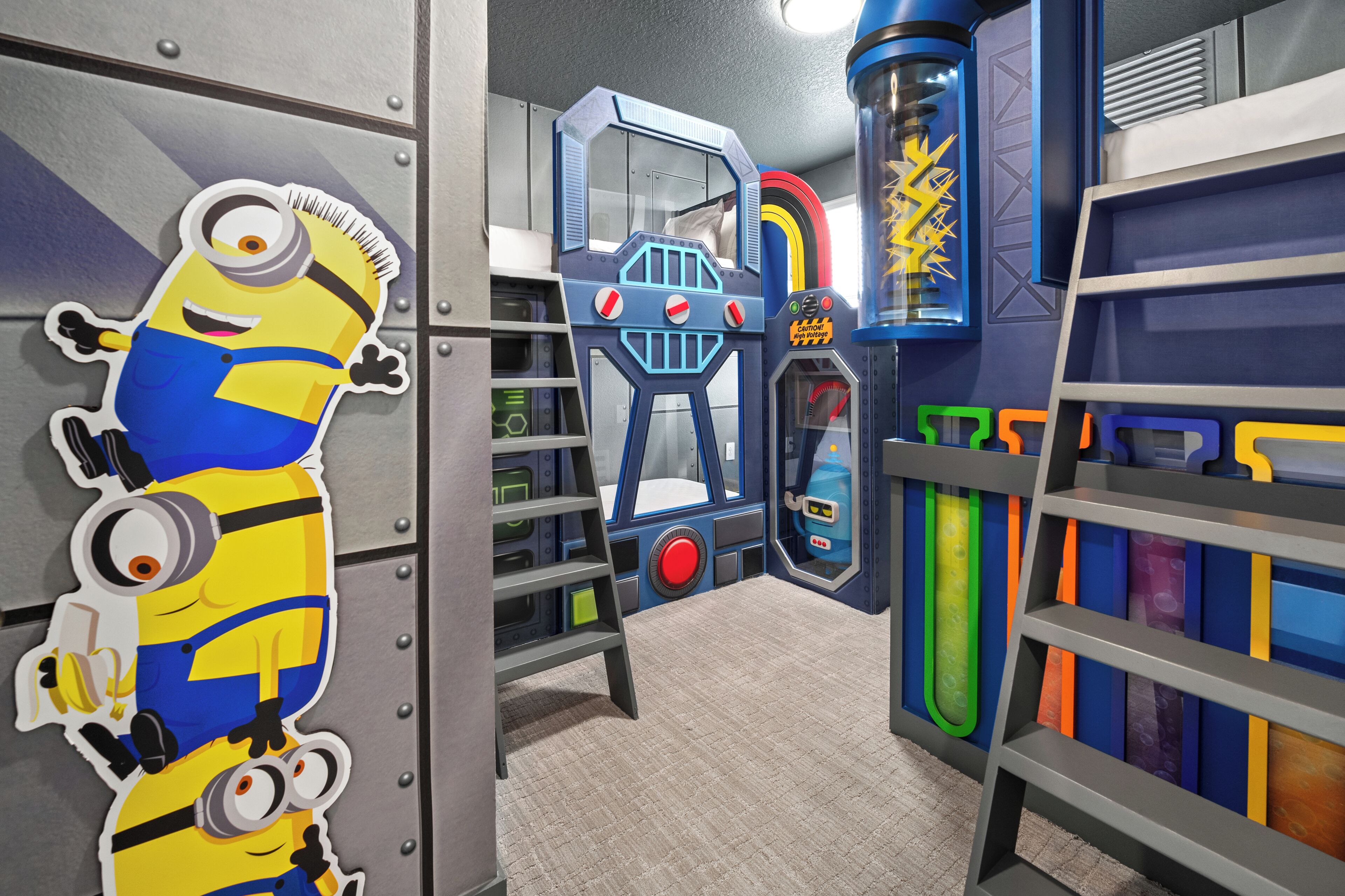 A play area with a Minion figure, a blue play structure, and colorful storage units.