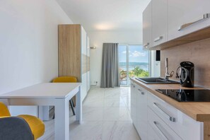 Fridge, stovetop, toaster, cookware/dishes/utensils