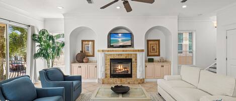 Smart TV, fireplace, books, offices