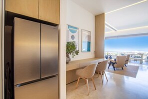 Kitchen amenities include a full-size refrigerator, oven, stove and dishwasher