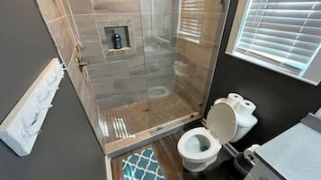 Shower, hair dryer, towels, soap