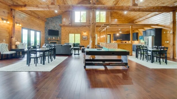 A spacious lodge with a pool table, dining area, and a cozy fireplace. - Sensational Views 4 Bedroom Cabin by Heavenly Views Resort (Gatlinburg)