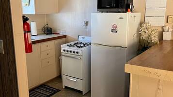 Fridge, microwave, toaster, cookware/dishes/utensils