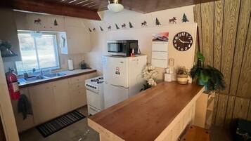 Fridge, microwave, toaster, cookware/dishes/utensils