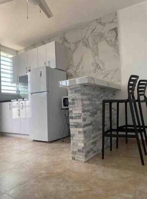 Fridge, microwave, coffee/tea maker, toaster