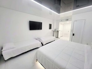 1 bedroom, desk, iron/ironing board, travel crib