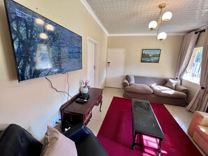Living area - A compact, cosy guesthouse exuding a home away from home feel. Lush garden too (Harare)
