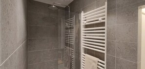 Shower, hair dryer, towels, toilet paper