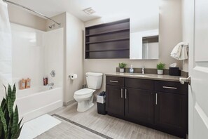 Bathtub, eco-friendly toiletries, hair dryer, towels