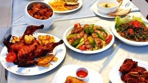 A table set with various dishes including fried chicken, spring rolls, and other meals. - NAPTIN EXECUTIVE HOTEL AND SUITES  (Jos)