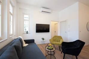 Apartamento, 2 quartos | Sala de estar