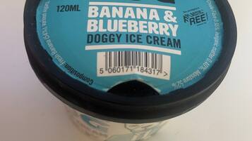 A container of Cool Dog Banana & Blueberry Doggy Ice Cream.