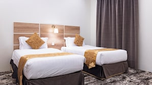 Egyptian cotton sheets, premium bedding, pillow-top beds, minibar - Garden View Hotel (Tabuk)