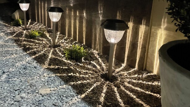 A pathway lined with decorative lights and plants, leading to a building. - OFFER Excellent Private House, Garden, BBQ, Garage.  (Ciudad Valles)