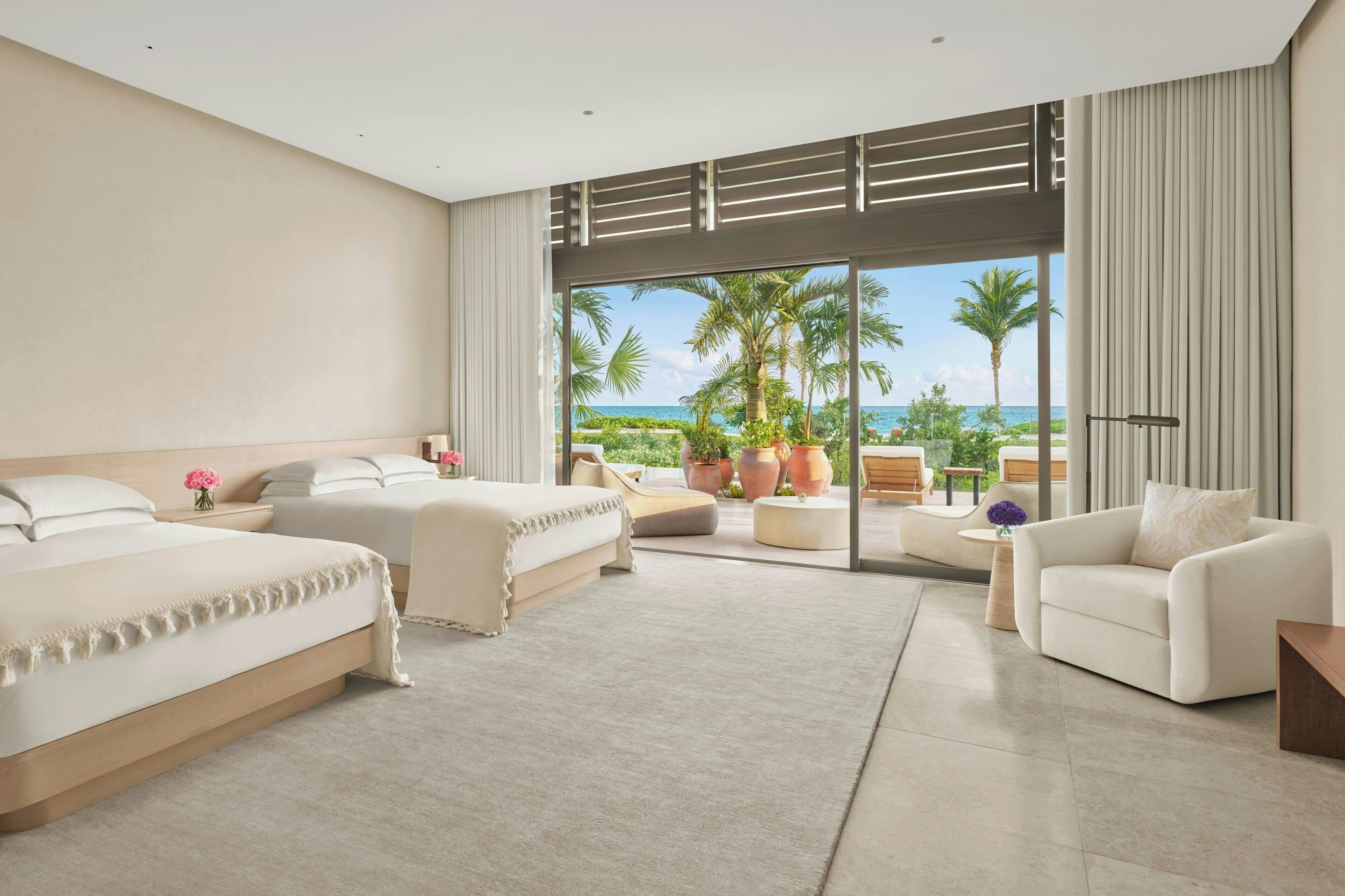 On the beach, white sand, beach cabanas, sun-loungers