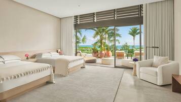 On the beach, white sand, beach cabanas, sun-loungers
