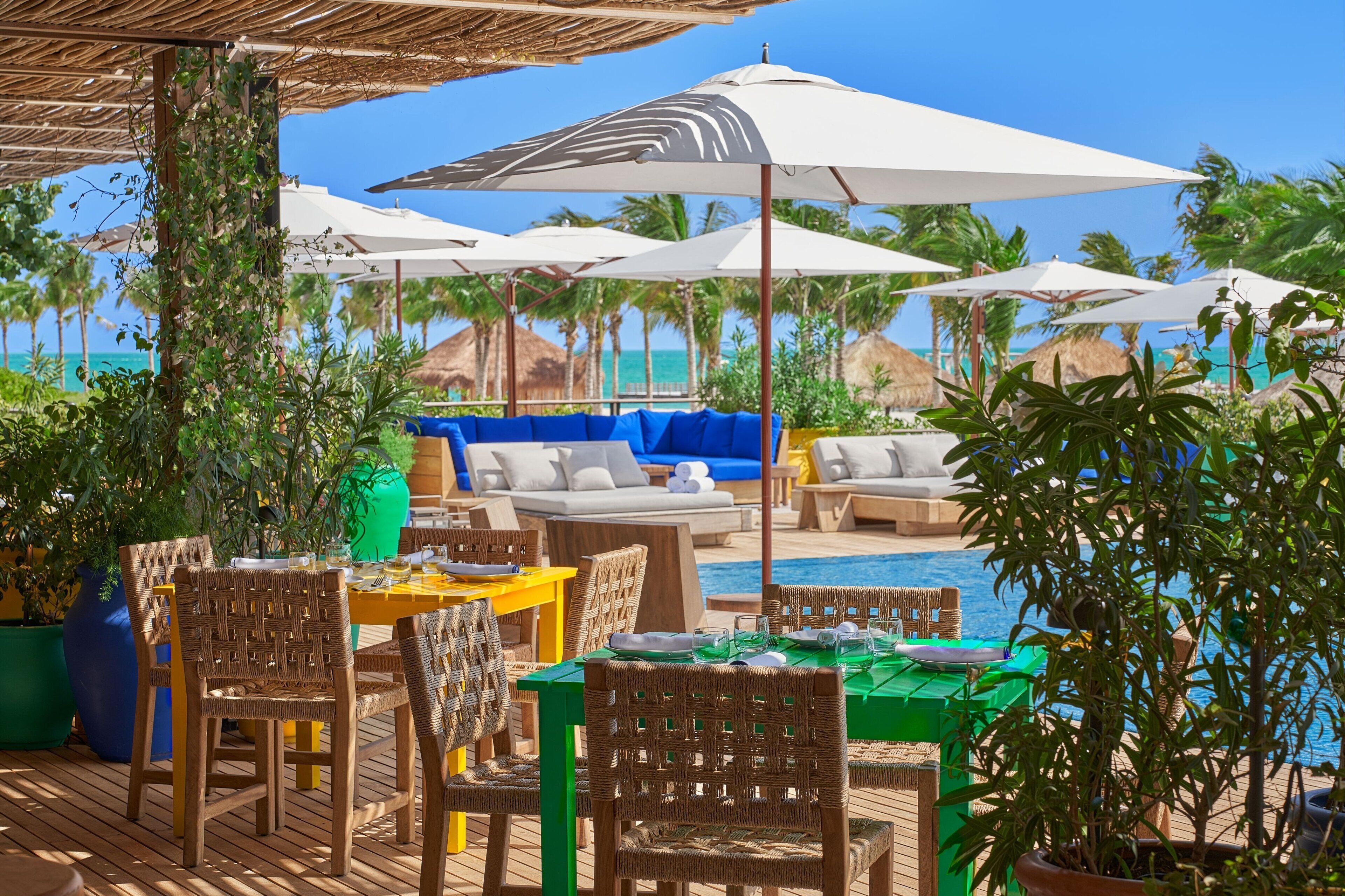 On the beach, white sand, beach cabanas, sun-loungers