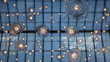 A ceiling with hanging spherical glass light fixtures.