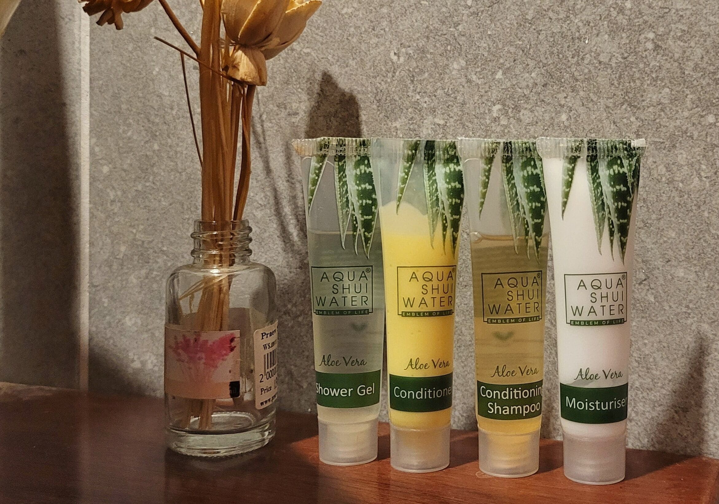 A collection of Aqua Shui Water products including Aloe Vera Shower Gel, Conditioner, Shampoo, and Moisturiser.