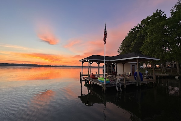 Our dock at sunset- sit and enjoy or take out a complimentary float or kayak!