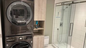 Shower, hair dryer, towels, soap