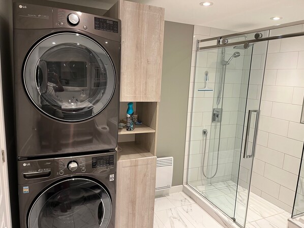 Shower, hair dryer, towels, soap
