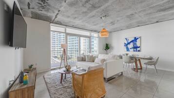 Deluxe Apartment | Living area | 50-inch Smart TV with cable channels