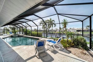 A heated pool - RUM CAY GETAWAY: South facing waterfront home, private pool/spa, bar, and dock. (Punta Gorda)