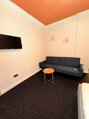 Family Studio Suite | Living area | 18-inch flat-screen TV with satellite channels - Salve (Tbilisi)