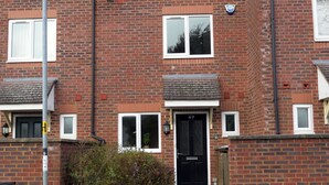 A two-story brick house with a black front door, a small front garden, and a visible number 49 on the door. - Spacious 3 bed  town house in Bristol. (Bristol)