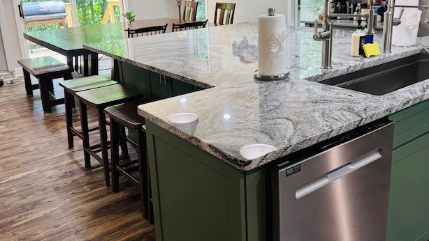 A kitchen with a central island, stainless steel dishwasher, and pendant lighting. - The Getaway at Wintergreen Resort (Wintergreen Resort)