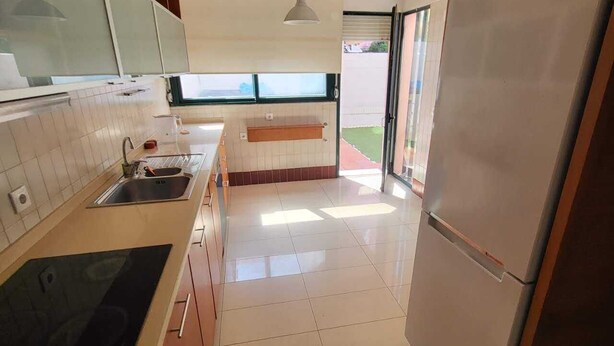 A modern kitchen with a refrigerator, sink, and stove. - Lisboa belem   elite domum (Lisbon)