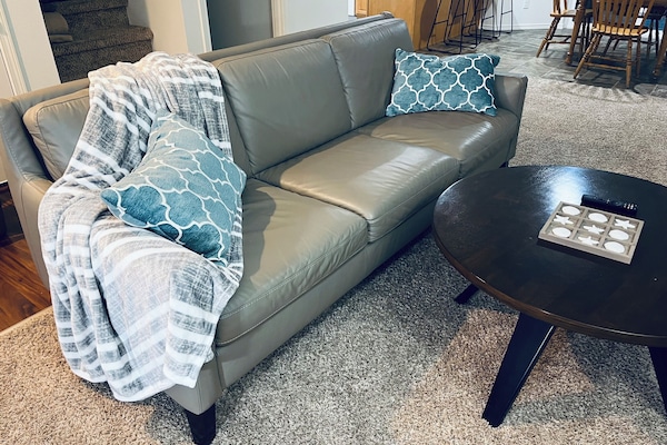 Relax on this genuine leather sofa while you watch some TV or chat by the fire!