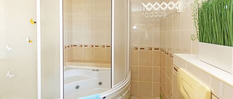 Family Villa | Bathroom | Rainfall showerhead, hair dryer, towels