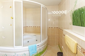 Family Villa | Bathroom | Rainfall showerhead, hair dryer, towels