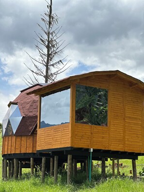 Situated in a natural setting, this cabin offers a view of the surrounding landscape.
