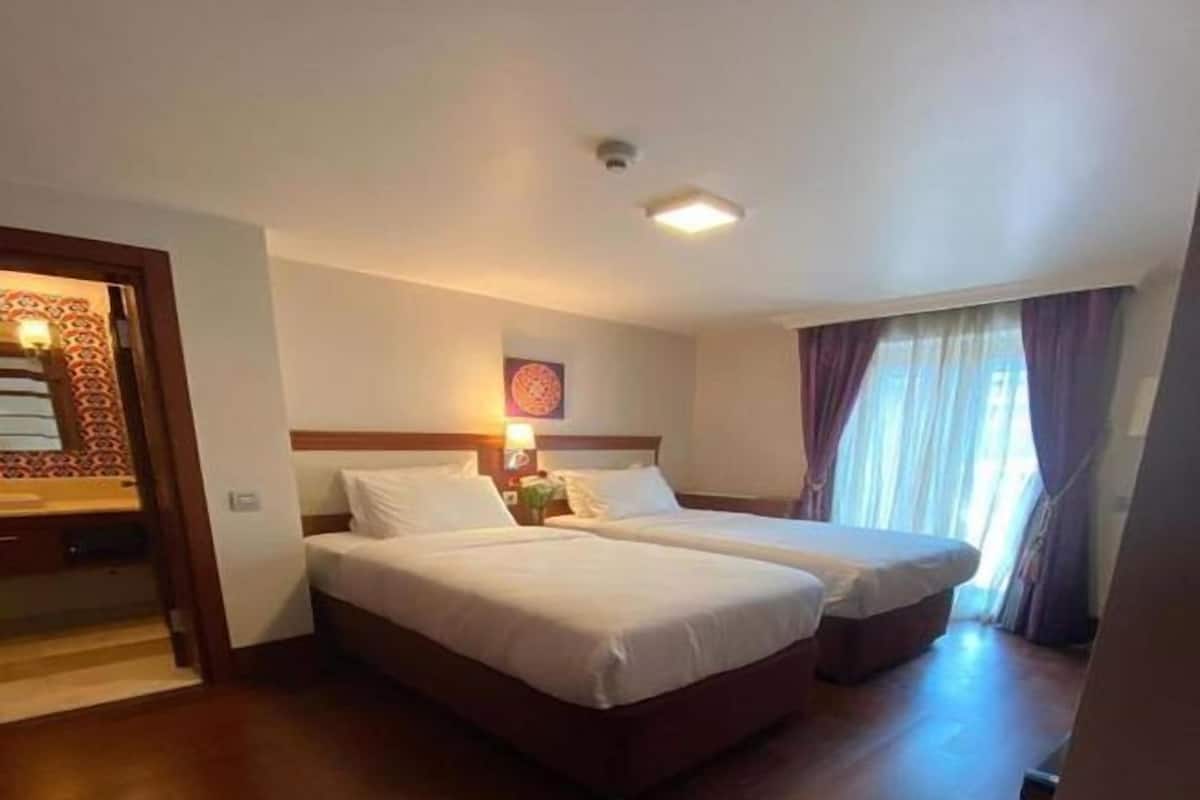 Family Quadruple Room, Non Smoking, City View | Down comforters, minibar, in-room safe, desk
