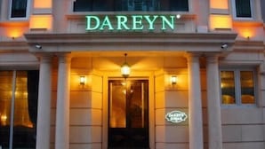 The exterior of a building with the name 'DAREYN' illuminated above the entrance. - Dareyn Konak Hotel (Istanbul)