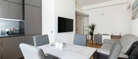 Apartment (2 Bedrooms) | Living area | 55-inch Smart TV with cable channels, TV