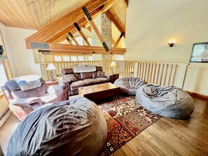 Smart TV, fireplace, foosball, books