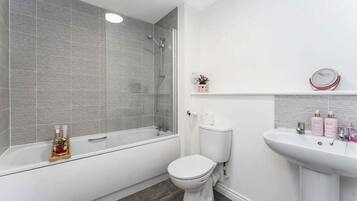 Bathtub, hair dryer, towels