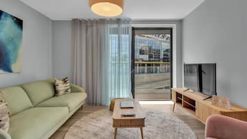 Deluxe Apartment, 2 Bedrooms, Kitchenette, City View | Living area | 40-inch TV with satellite channels