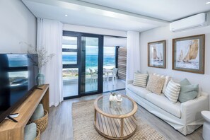 One Bed Sea View First Floor 204 | Living room | 42-inch Smart TV with satellite channels - Esplanade Hermanus (Hermanus)