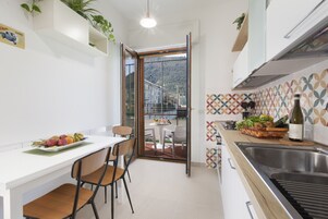Apartment, 2 Bedrooms, Balcony | Private kitchen | Microwave, dishwasher, coffee/tea maker, cookware/dishes/utensils