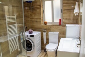 Shower, towels, soap, toilet paper