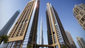 High-rise buildings with a prominent central tower, likely a landmark. - Sumptuous 1BR at Act One Act Two Tower 1 Downtown Dubai by Deluxe Holiday Homes (Dubai)