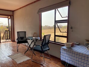 Dining - Cozy wooden cabin overlooking the foot of the Tswapong Hills in Palapye. (Palapye)
